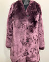 close up photo of the purple fake fur jacket on a mannequin against a white background. showing the button closure and sleek ultra-soft faux fur. SpiritHoods Online Sample Sale Style: Luxe V-Neck Faux Fur Coat in Lavender Wolf in Size X-SMALL.