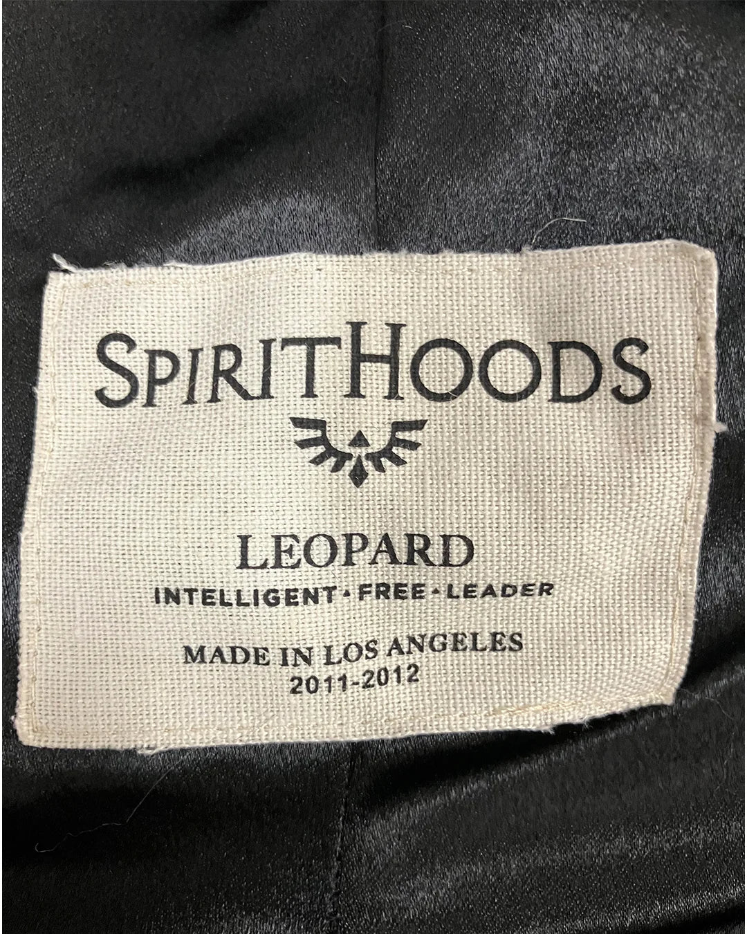 closeup of the neck Label with 'SpiritHoods' branding & Made in Los Angeles 2011-2012 and text on a black background