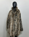 grey Faux Fur coat on a mannequin against a white background