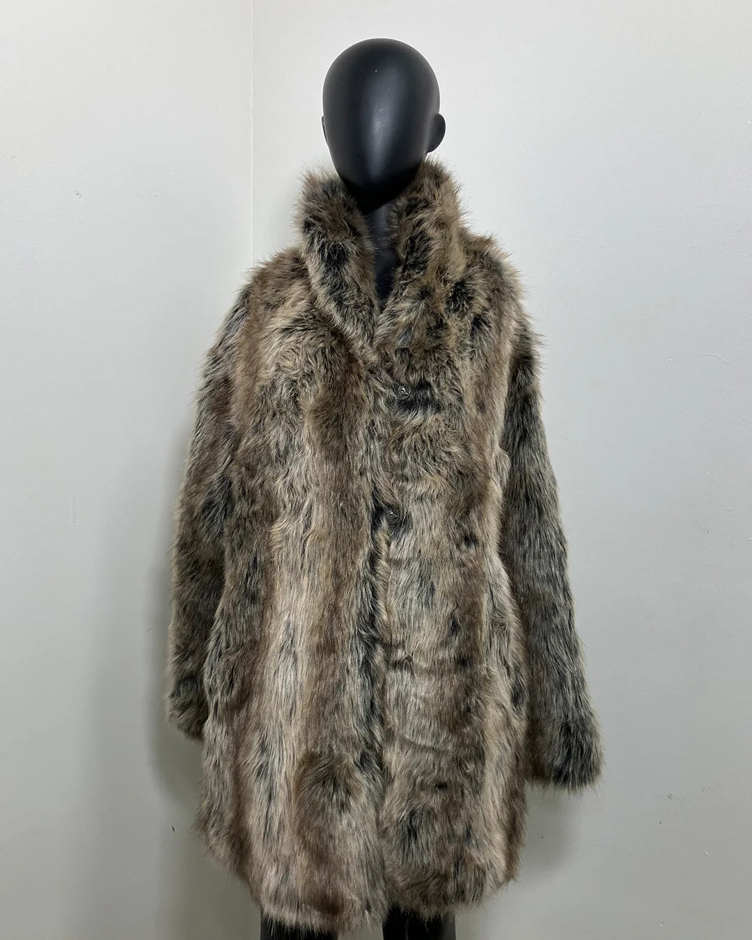 grey Faux Fur coat on a mannequin against a white background