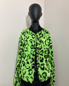 a mannequin wearing a neon green leopard bomber jacket 