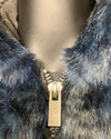 Close-up of a fake fur cropped jacket coat with a SpiritHoods branded zipper and logo.