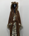 mannequin wearing a leopard print long luxury faux fur robe against a white wall