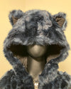 Indigo Leopard Print Fake Fur Cropped Jacket Hood with Cat Ears on a mannequin against a beige background