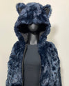 Blue faux fur cropped jacket with animal ears on a mannequin against a beige background