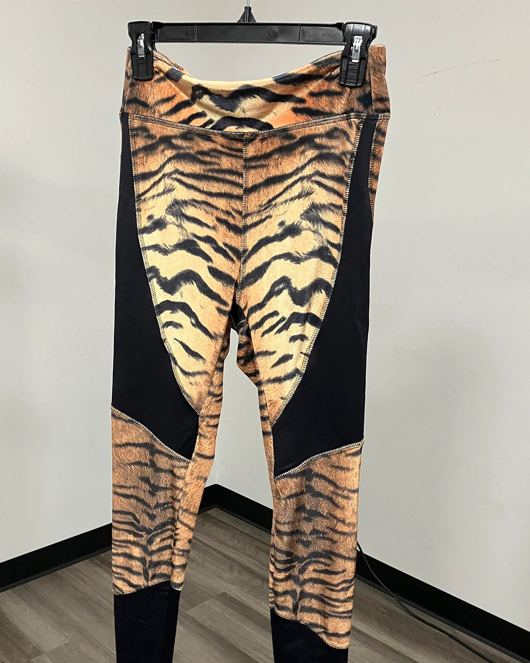 Tiger striped pattern leggings with contrast black panels.