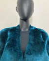 Teal faux fur coat on a mannequin against a plain background showing the v-neck front.  SpiritHoods Online Sample Sale Style: Luxury V-Neck Plush Faux Fur Coat in Royal Wolf in Size MEDIUM