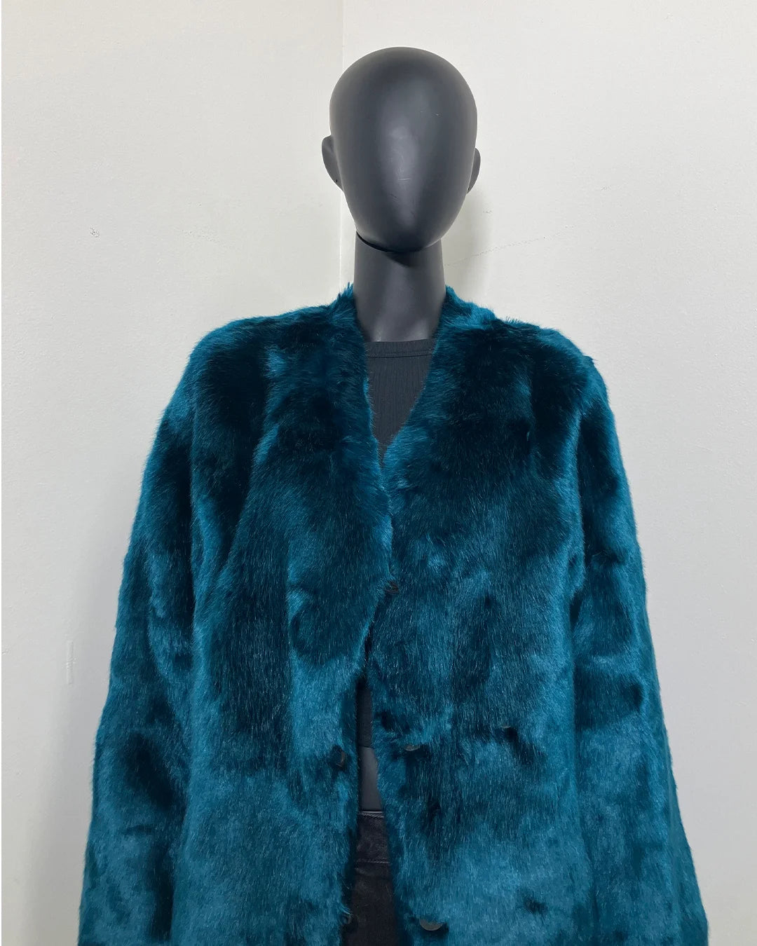 SpiritHoods Online Sample Sale Style: Luxury V-Neck Plush Faux Fur Coat in Royal Wolf in Size MEDIUM close up of the front of the coat on a black mannequin