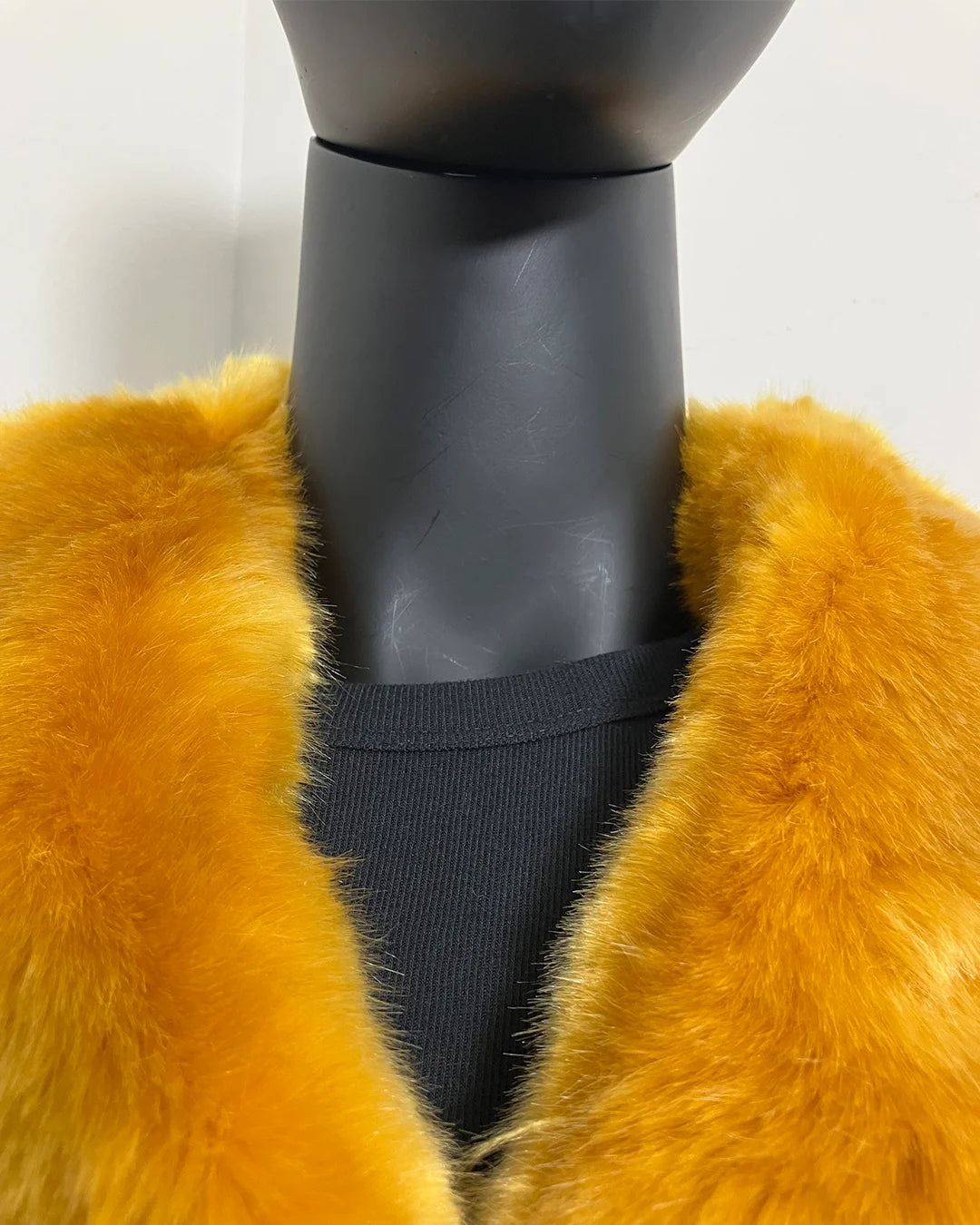 close up photo of the luxury tissavel plush faux fur and v-neck front on the mannequin. SpiritHoods Online Sample Sale Style: Luxury V-Neck Faux Fur Coat in Golden Wolf size X-SMALL.
