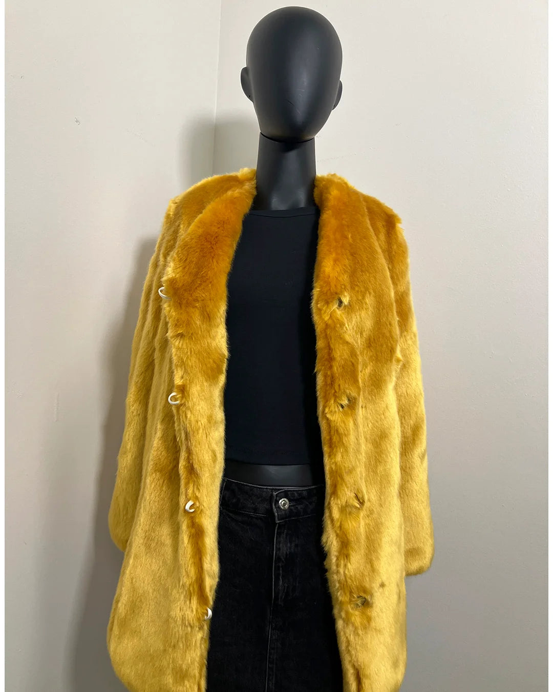 Golden Yellow Faux Fur Coat on a black mannequin against a white background with a v-neck front and princess cut. SpiritHoods Online Sample Sale Style: Luxury V-Neck Faux Fur Coat in Golden Wolf size X-SMALL.