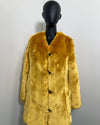 Golden Yellow Faux Fur Coat on a black mannequin against a white background with a v-neck front and princess cut. SpiritHoods Online Sample Sale Style: Luxury V-Neck Faux Fur Coat in Golden Wolf size X-SMALL.