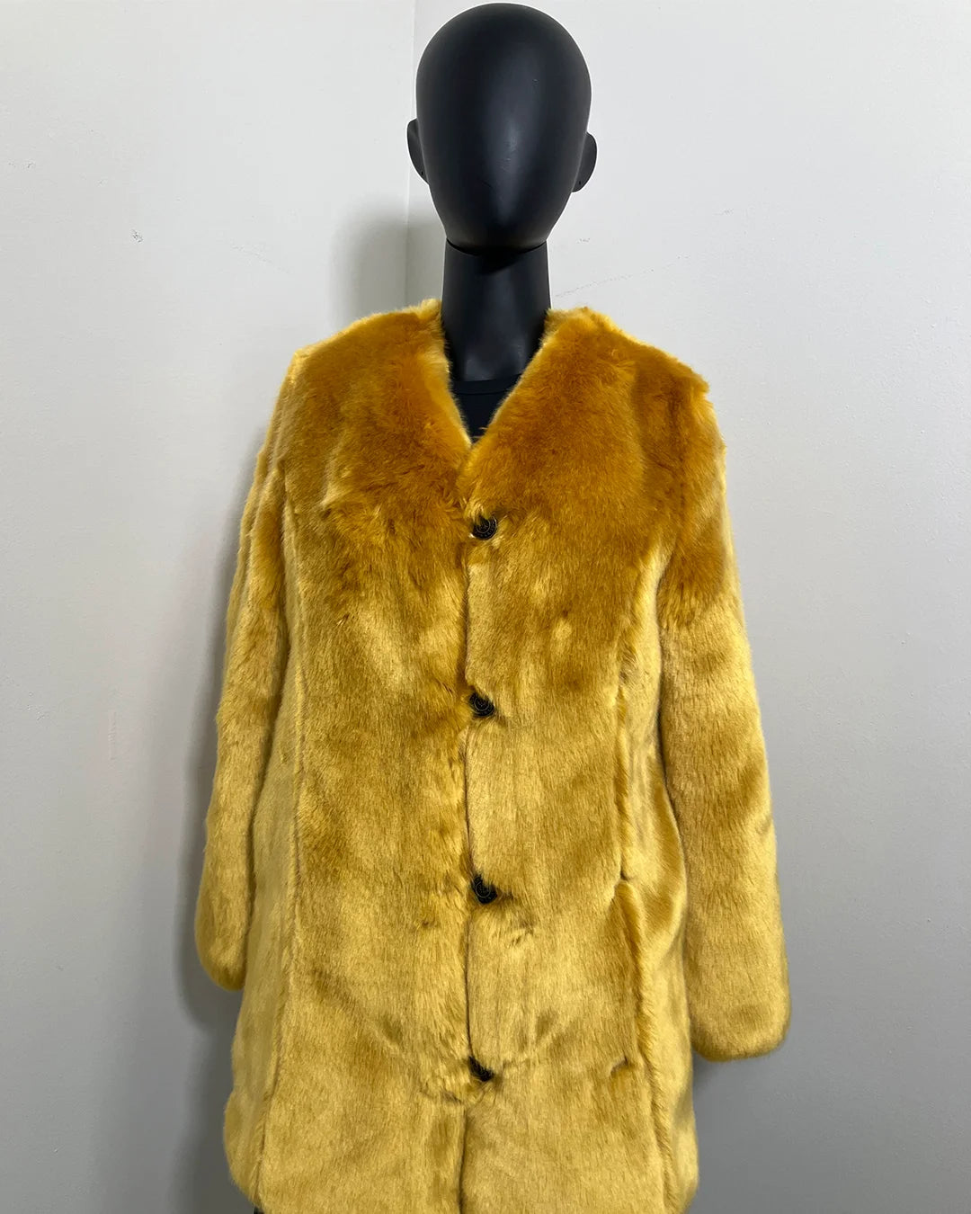 Golden Yellow Faux Fur Coat on a black mannequin against a white background with a v-neck front and princess cut. SpiritHoods Online Sample Sale Style: Luxury V-Neck Faux Fur Coat in Golden Wolf size X-SMALL.