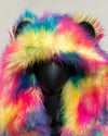 Multicolored rainbow faux fur coat with oversized hood and bear ears on a mannequin against a gray background