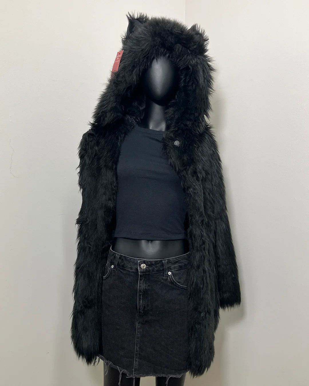 Mannequin wearing a black fake fur coat and with hood and wolf ears. SpiritHoods Online Sample Sale style: Classic Faux Fur Coat in Black Wolf size X-SMALL.