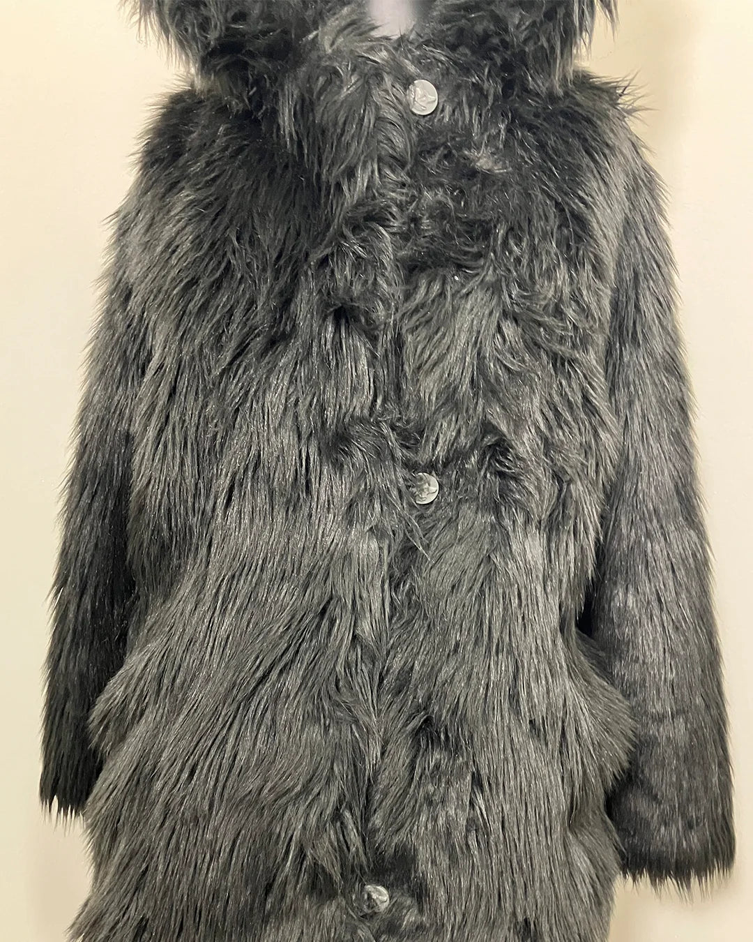 Mannequin wearing a black fake fur coat and with hood and wolf ears. SpiritHoods Online Sample Sale style: Classic Faux Fur Coat in Black Wolf size X-SMALL.