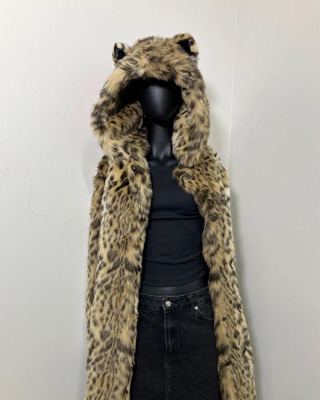Cheetah Print Fake Fur Jacket with an oversized hood with ears on a mannequin against a plain background