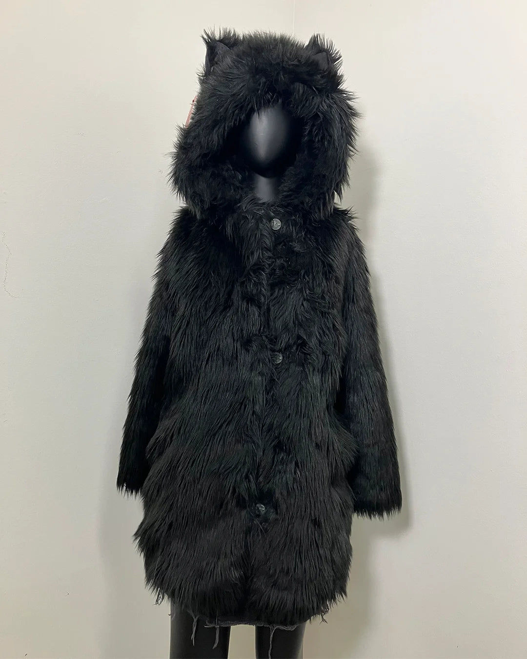 Black furry fake fur coat with wolf ears on a mannequin against a white background. SpiritHoods Online Sample Sale style: Classic Faux Fur Coat in Black Wolf size X-SMALL.