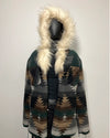 Patterned coat with fur-lined hood on a mannequin against a white background