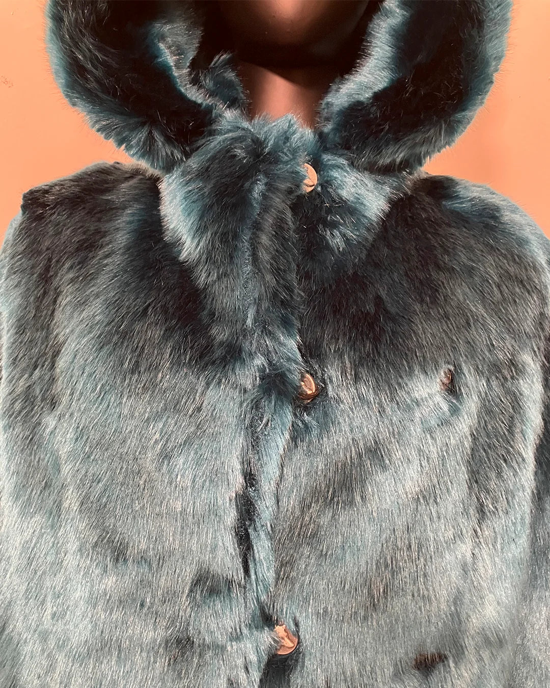 close up photos of the wolf face buttons and peacoat button closure on the SpiritHoods Online Sample Sale Style: Classic Luxe Faux Fur Coat in Royal Wolf size MEDIUM