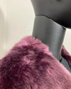 Close-up of a lavender fake fur garment on a mannequin against a neutral background