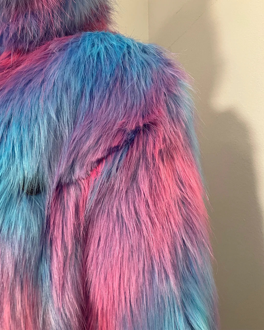 close-up photo of some choppy faux fur/blunt cut fake fur near the seams where the faux fur shoulder and arm seam meet. SpiritHoods Online Sample Sale Style: Classic Faux Fur Coat in Cotton Candy Bear in size X-SMALL.