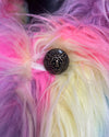 Close up photo of the Dreamland Cat Multicolored plush colorful fake fur showcasing the custom leopard face button closure.