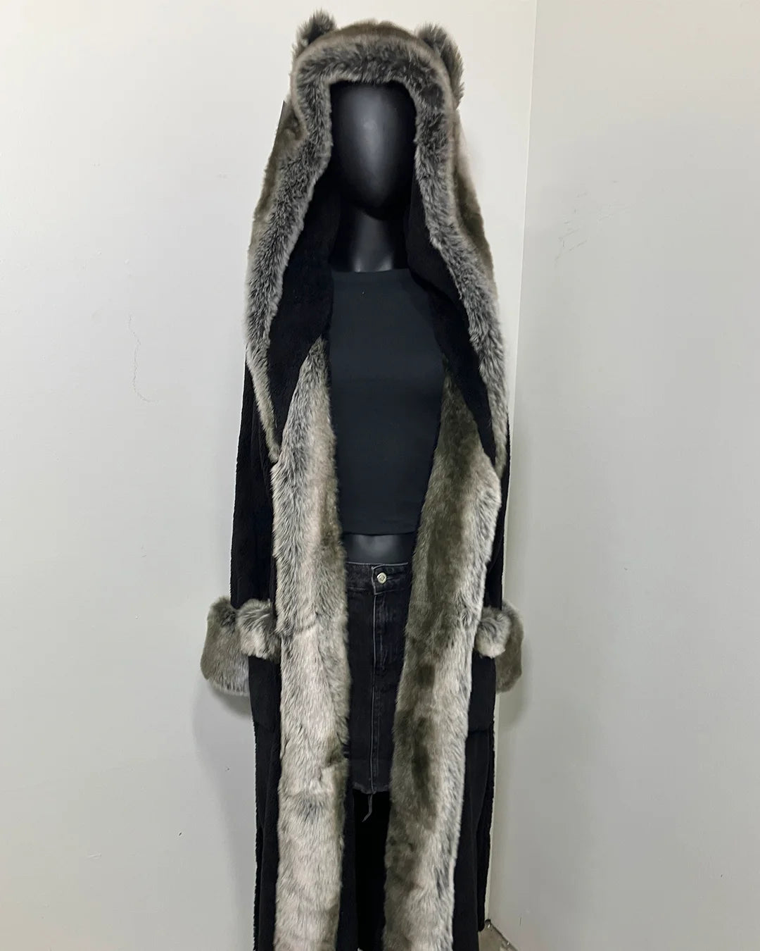 mannequin wearing a grey wolf faux fur spirithoods robe with black fabric body trimmed with a grey short pile fake fur