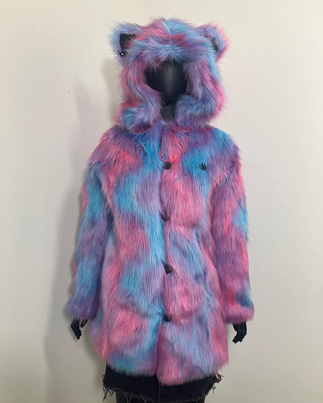 Mannequin Wearing a blue and pink multicolor faux fur coat with hood and bear ears. SpiritHoods Online Sample Sale Style: Classic Faux Fur Coat in Cotton Candy Bear in size X-SMALL.