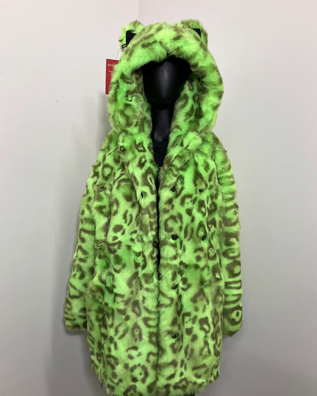 Green leopard print hooded faux fur coat on a mannequin against a white background