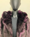 Purple fur coat on a mannequin against a beige background