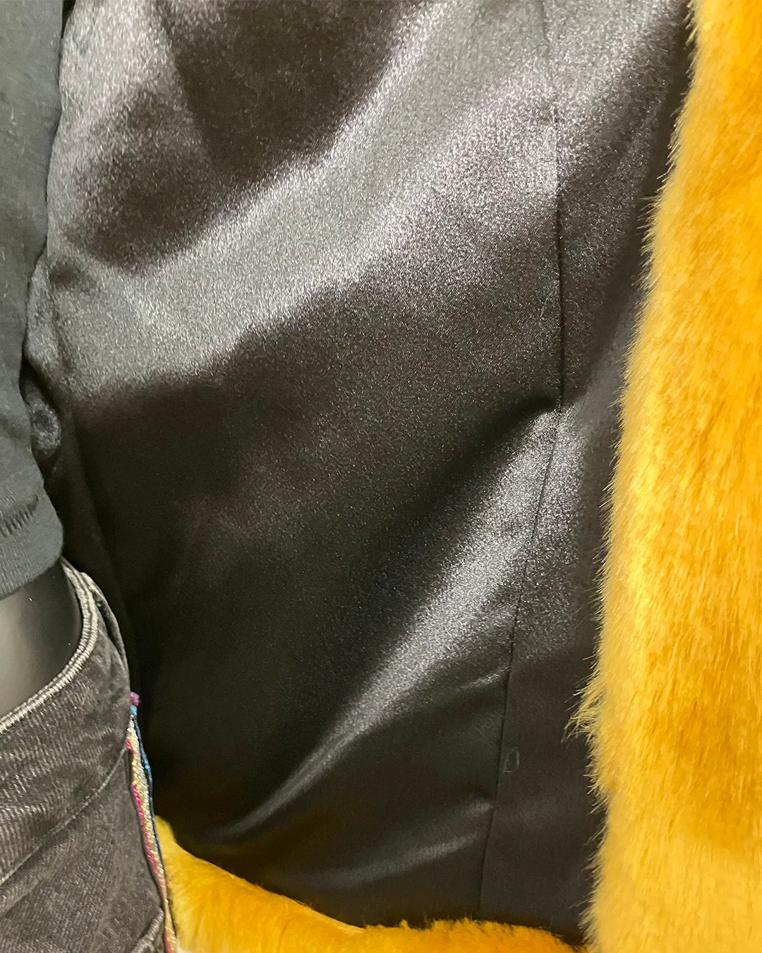 close-up photo of the black poly-satin lining.