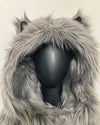 Mannequin wearing an oversized hood with k-9 ears,  on a plain background