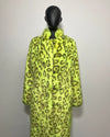 Mannequin wearing a bright yellow leopard print coat against a plain background