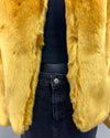 close up photo of the plush faux fur - where the hook and eye button closure is. SpiritHoods Online Sample Sale: one of a kind golden wolf faux fur bomber in luxe tissavel yellow fake fur in size MEDIUM.