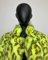 Mannequin wearing a bright yellow leopard print coat against a plain background
