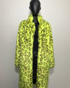 Mannequin wearing a bright yellow leopard print coat against a plain background
