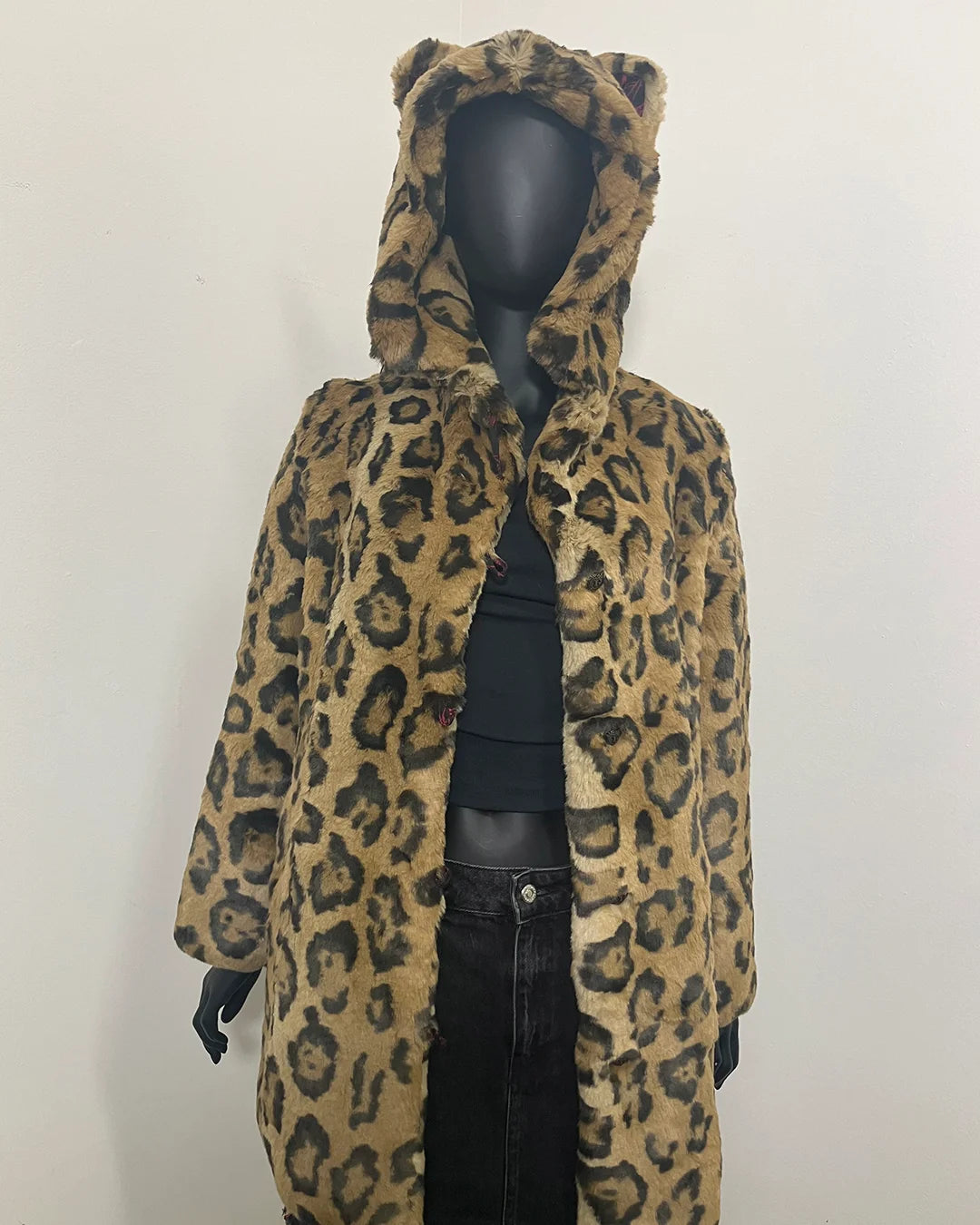 mannequin wearing the XS Luxe Jaguar Print Faux Fur Coat in a relaxed fit without the buttons closed, showing the hood on the maneequin and two feline ears. SpiritHoods Online Sample Sale Style: Luxe Classic Faux Fur Coat in Jaguar Size X-SMALL.