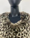 Mannequin wearing a leopard print fake fur coat against a white background