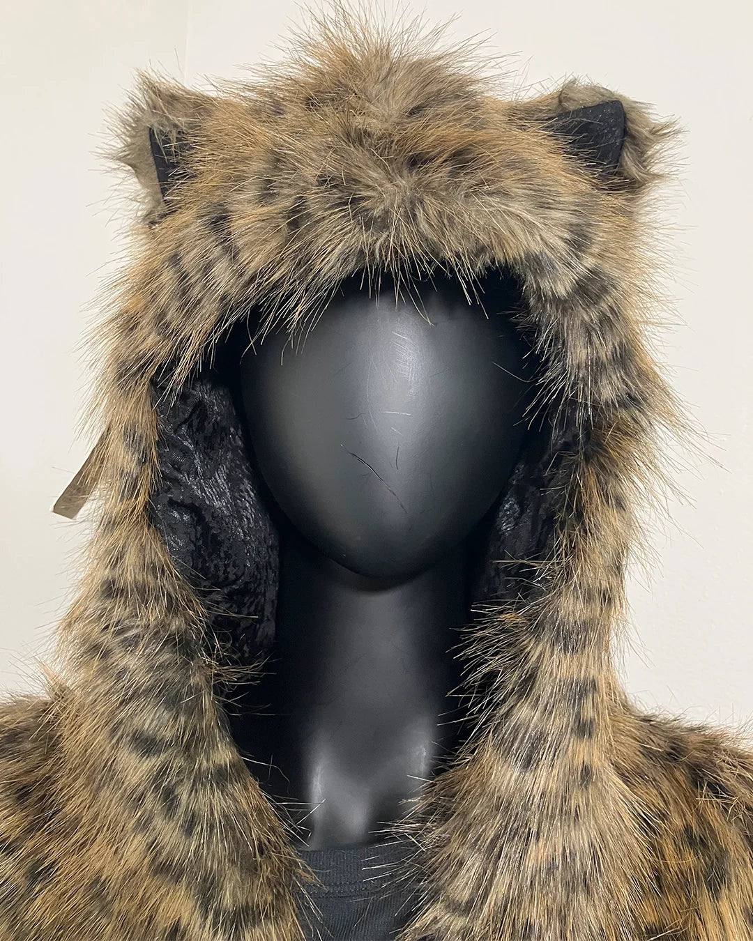 Close Up Photo of the SpiritHoods Online Sample Sale Savannah Cat Classic Faux Fur Bomber Jacket in Size Medium show casing the ears and hood