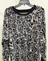 grey/black Leopard print sweater on a hanger against a white background