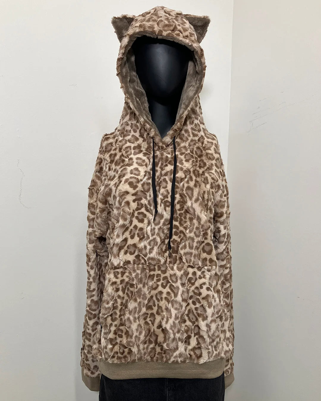 mannequin wearing a tan strawberry leopard print hoodie with the hood on showcasing tiny kitty ears