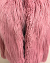 Close-up of pink fluffy fake fur bomber jacket fabric texture
