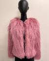 Pink fluffy jacket on a mannequin against a plain background