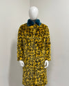 Long yellow leopard print coat on a mannequin 