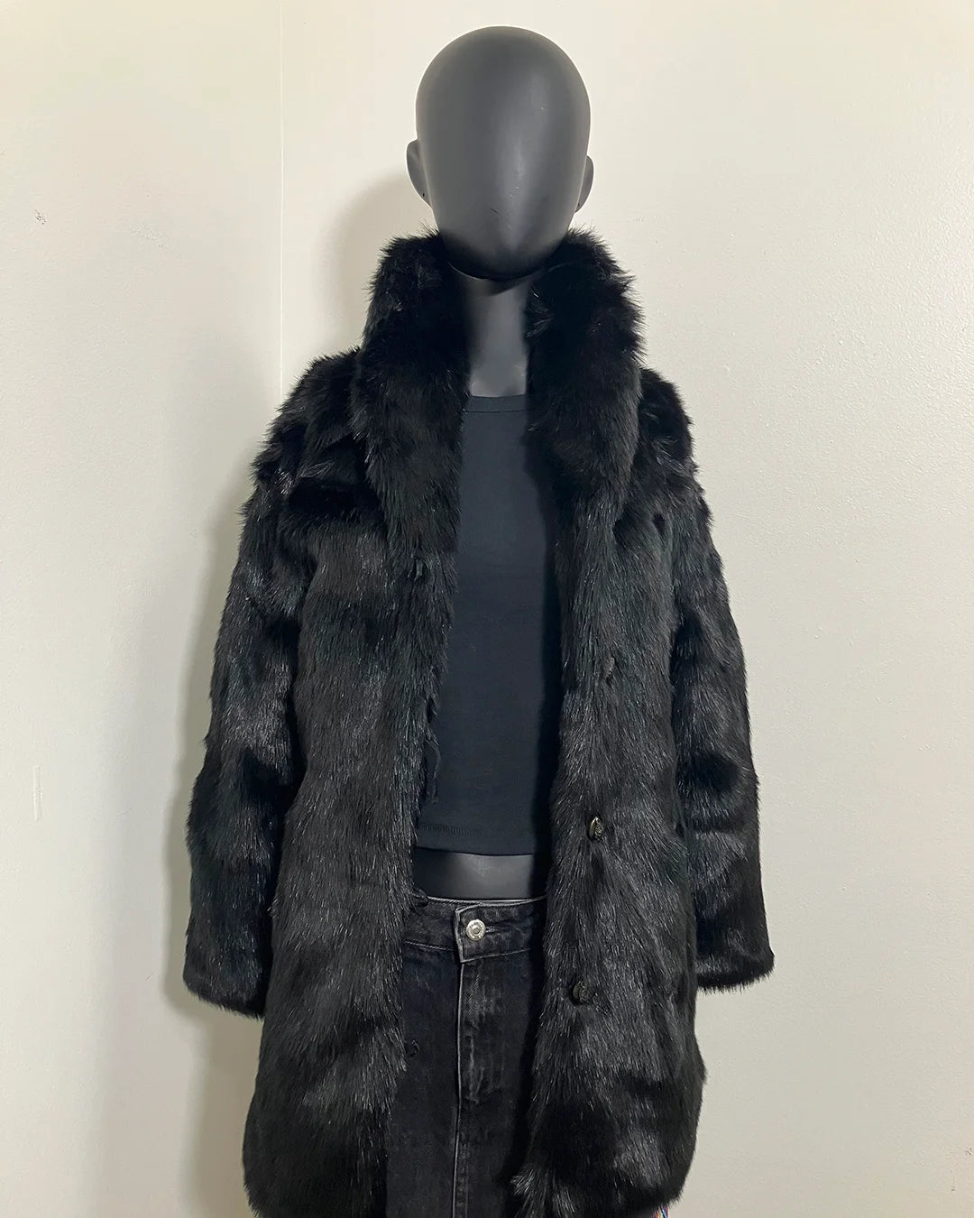 Mannequin wearing a black faux fur collared coat against a plain background | SpiritHoods Online Sample Sale Style: Faux Fur Coat in Black Panther Size XXS