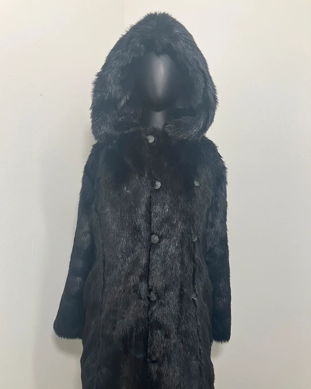 Black fake fur jacket with hood on a mannequin against a plain background. Showing the button closure + two rows of custom buttons. SpiritHoods Online Sample Sale Style: Hooded Faux Fur Coat - Black Panther in Size X-SMALL