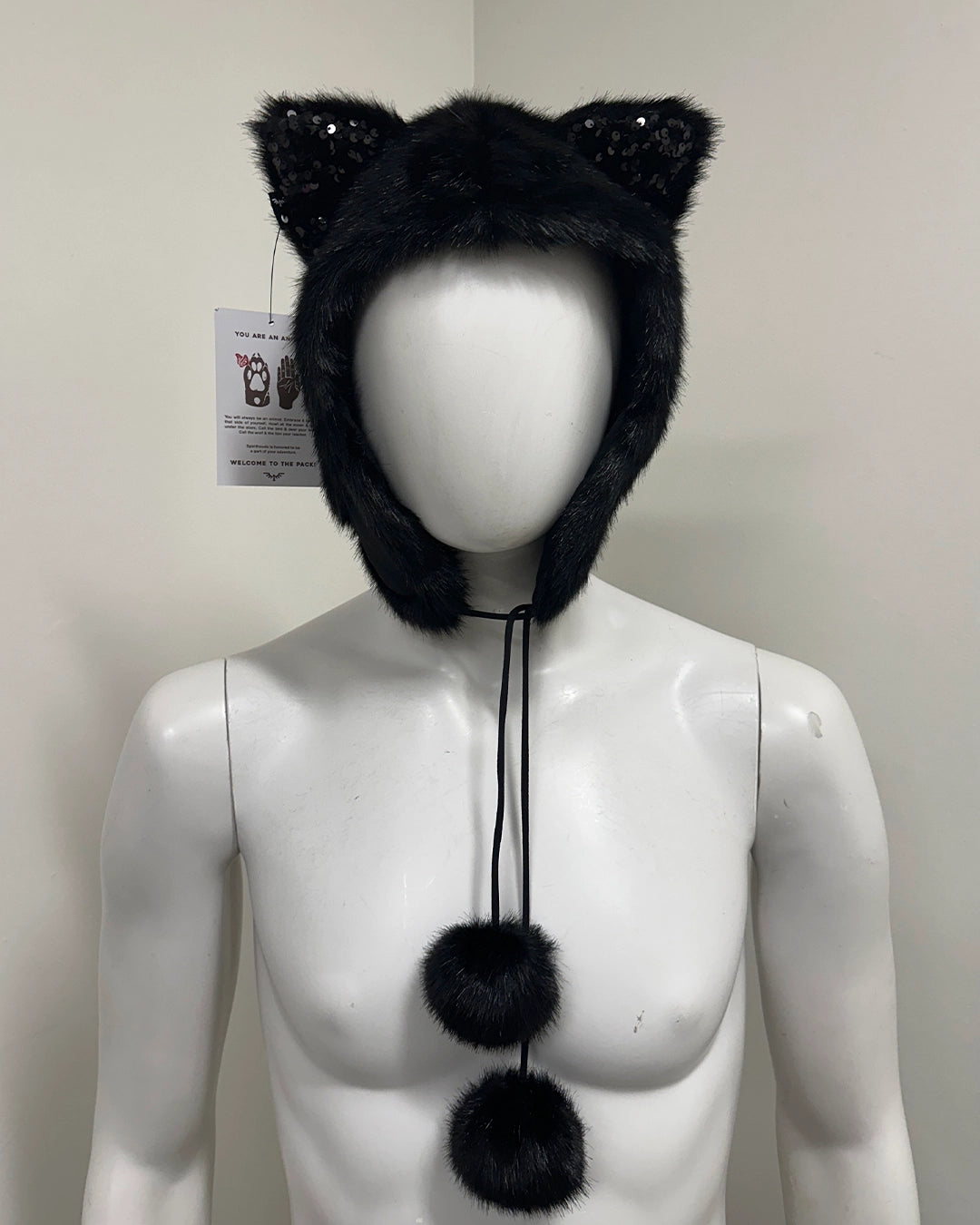 Black furry hat with cat ears and pom-poms 