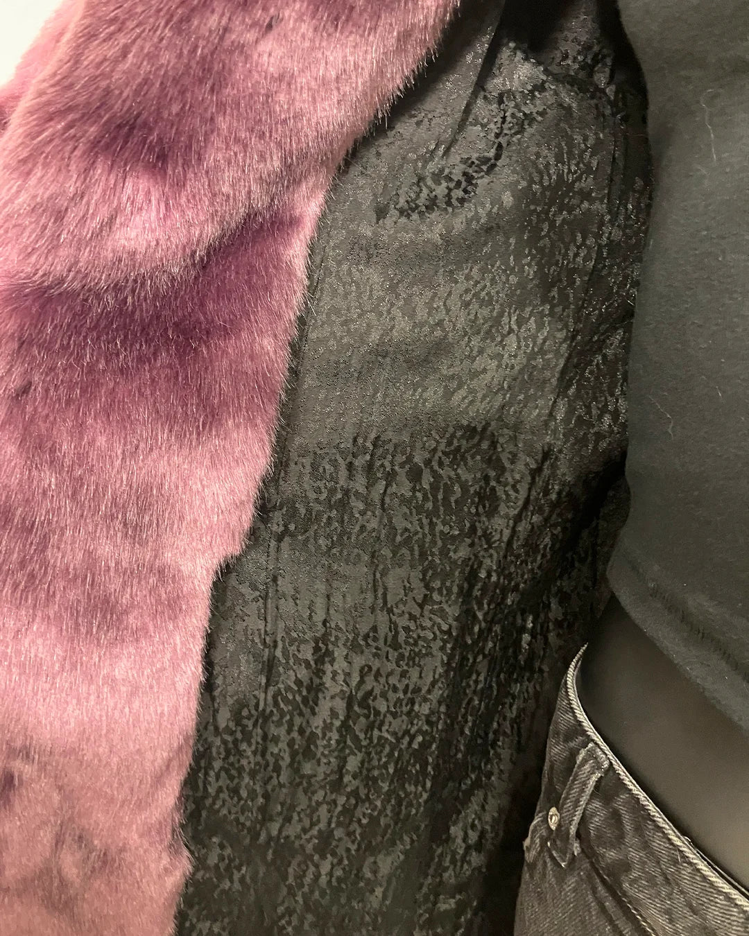 Close-up of a textured black 'snakeskin inspired' lining of the SpiritHoods Online Sample Sale Classic Luxe Purple Fake Fur Jacket in Lavender Panther in size XXS