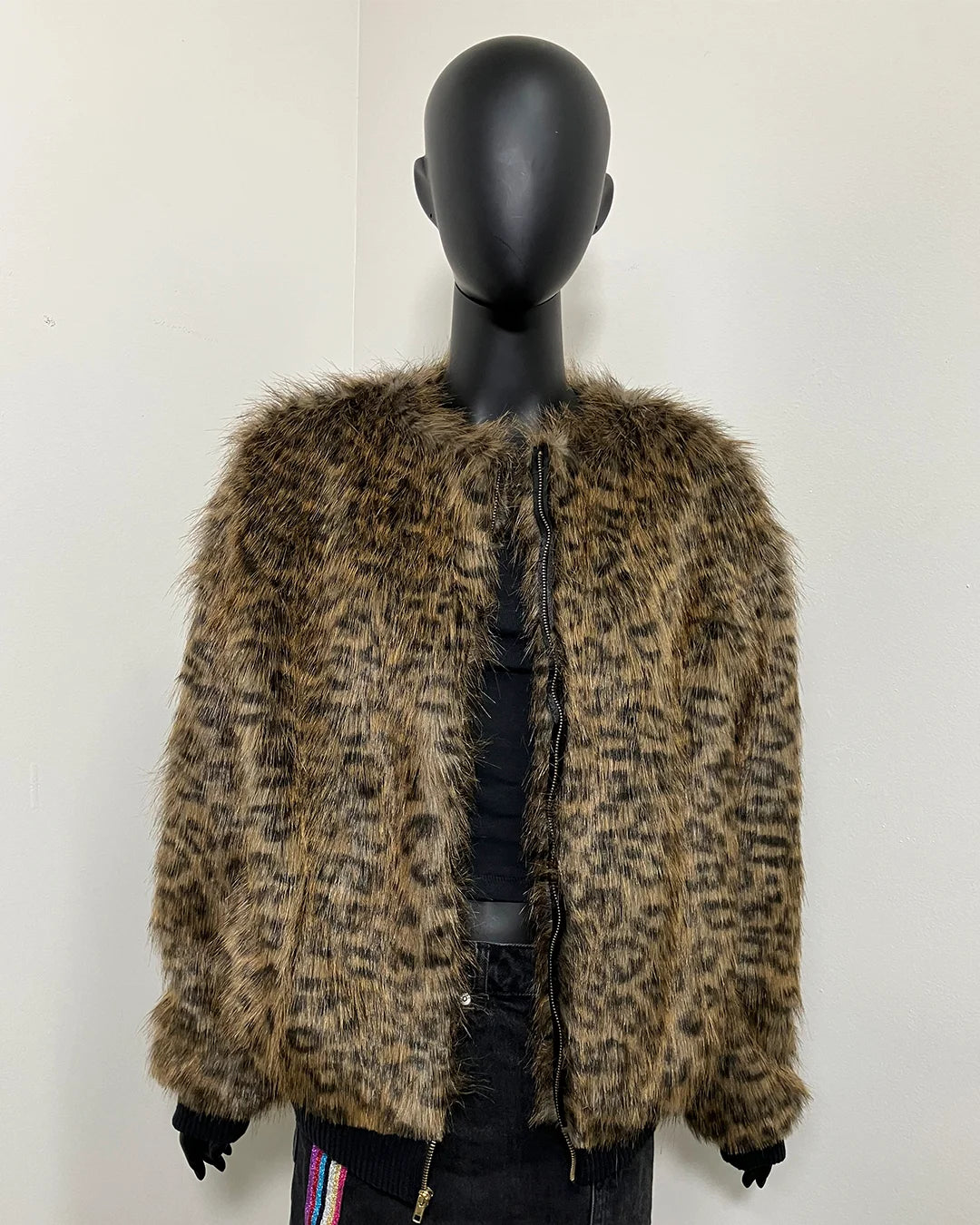 Mannequin wearing a leopard print faux fur coat against a white background in a size small with front zipper closure