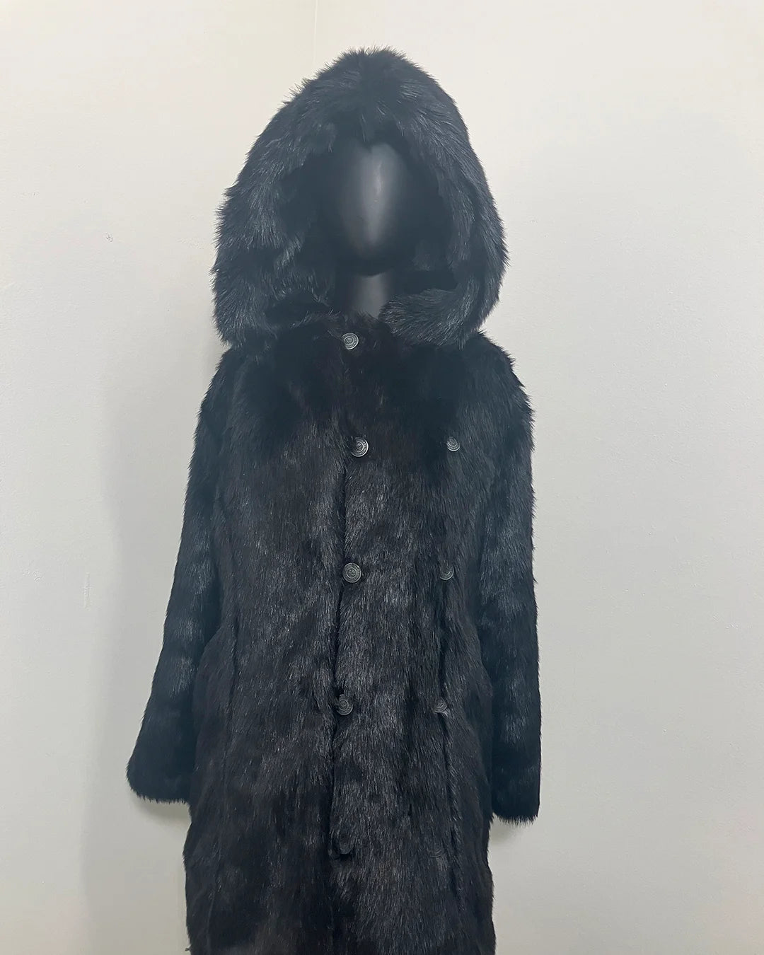 mannequin wearing an all black faux fur coat with an oversized hood and peacoat buttons. SpiritHoods Online Sample Sale Style: Hooded Faux Fur Coat - Black Panther in Size X-SMALL